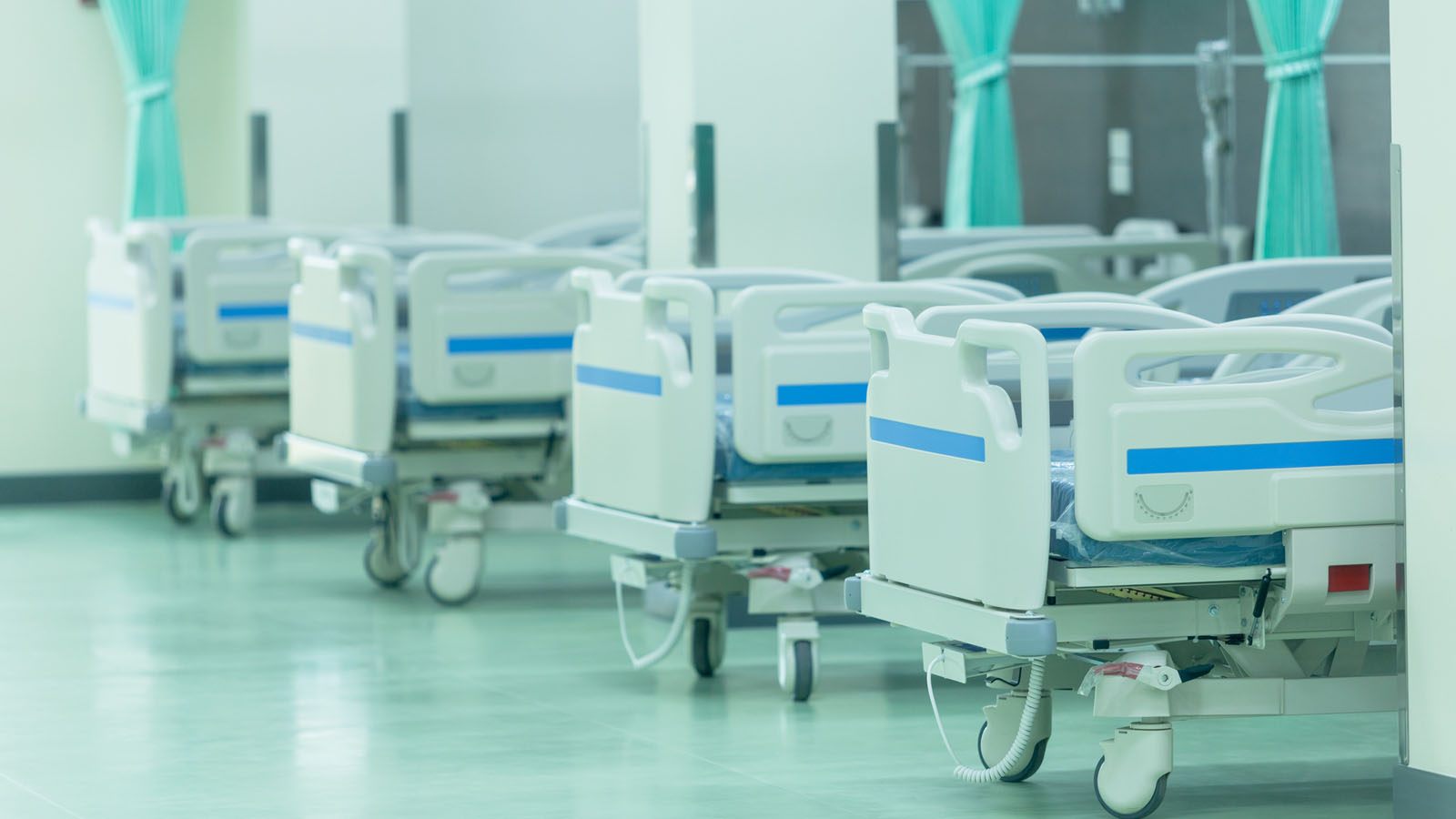 A row of empty hospital beds